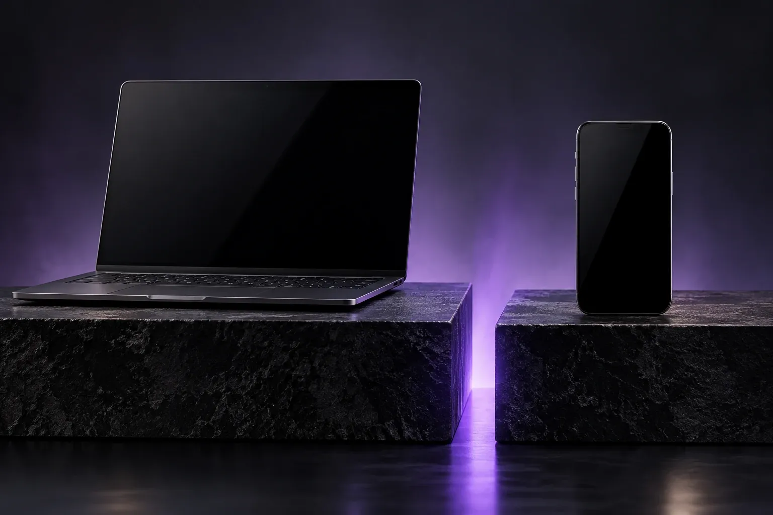 Laptop and phone on separate plinths illustrating different device trust boundaries